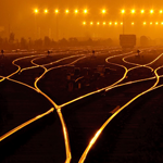 railroad tracks with lights