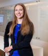 Employee Standing At Table