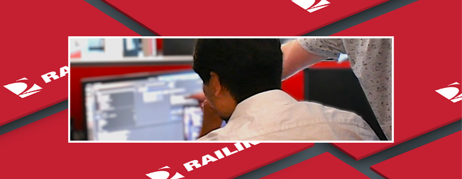Employee pointing at computer screen